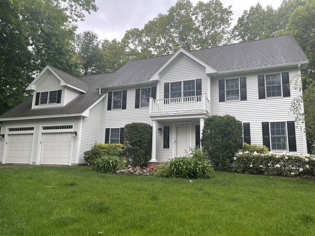 34 Woodcliffe Road Lexington, MA 02421 - Photo 1 of 34 a front view of a house with a garden
