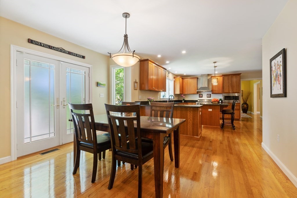 34 Woodcliffe Road Lexington, MA 02421 - Photo 16 of 34 a view of a dining room with furniture and a chandelier