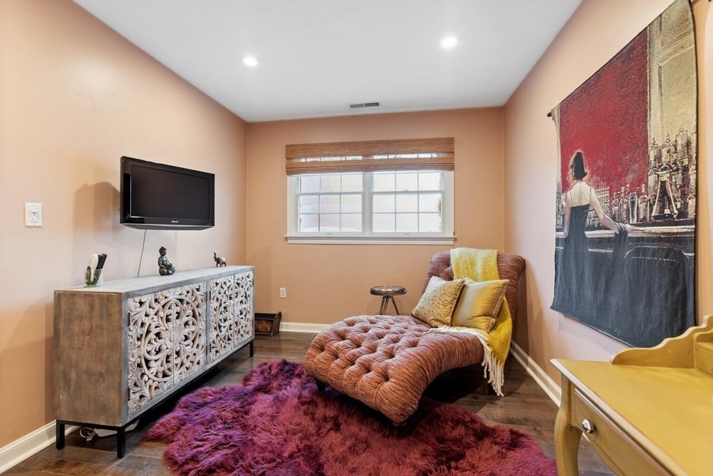 34 Woodcliffe Road Lexington, MA 02421 - Photo 23 of 34 a bedroom with furniture and a flat screen tv
