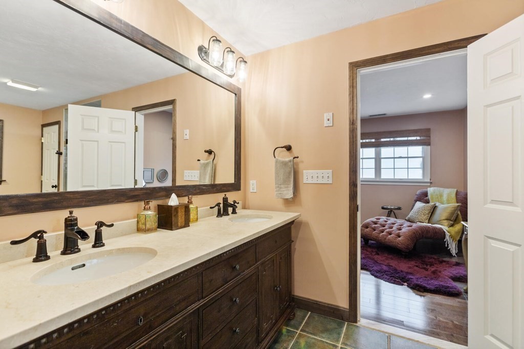 34 Woodcliffe Road Lexington, MA 02421 - Photo 24 of 34 a en suite bathroom with double sink and a mirror