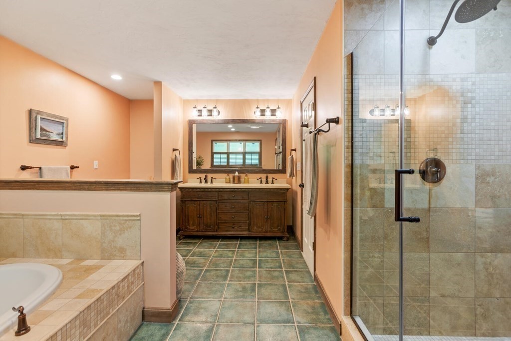 34 Woodcliffe Road Lexington, MA 02421 - Photo 26 of 34 a bathroom with a tub a sink a mirror and a shower