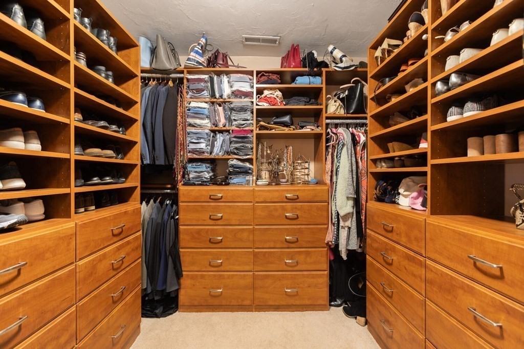 34 Woodcliffe Road Lexington, MA 02421 - Photo 27 of 34 a view of walk in closet with clothes and shoes