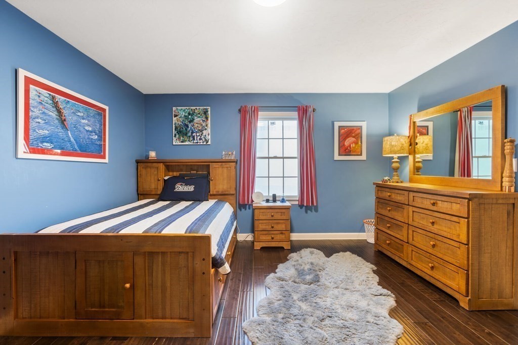 34 Woodcliffe Road Lexington, MA 02421 - Photo 29 of 34 a bedroom with a bed and a dresser
