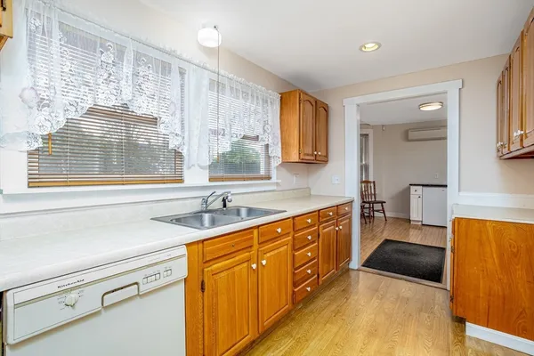 a kitchen with stainless steel appliances a sink stove and cabinets