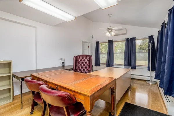 a dining room with a table chairs and chandelier