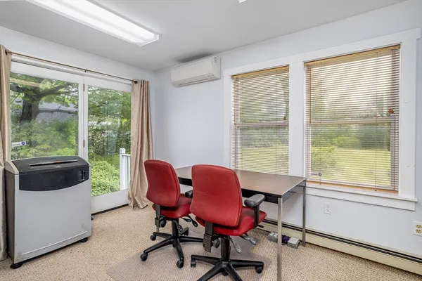 a work room with furniture and a window