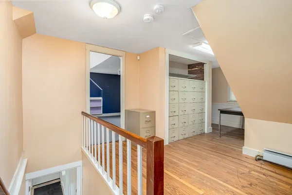 a view of a hallway with stairs