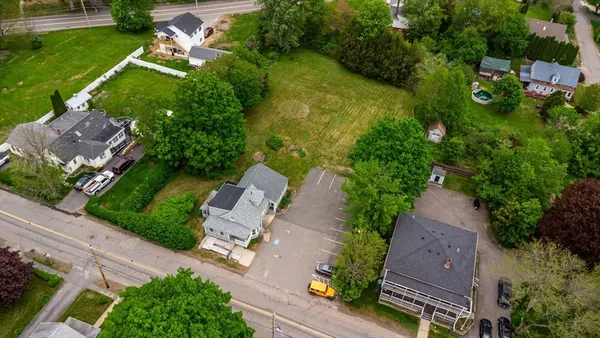 an aerial view of a house with yard