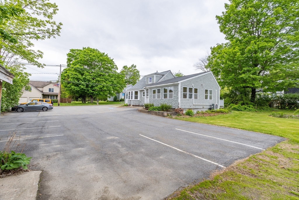18 North Main Street Templeton, MA 01436 - Photo 34 of 42 a view of swimming pool with outdoor seating and trees in the background