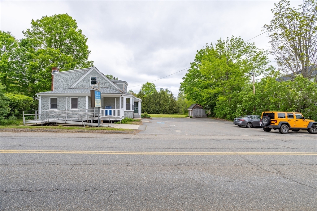 18 North Main Street Templeton, MA 01436 - Photo 40 of 42 a front view of a house with a yard and garage