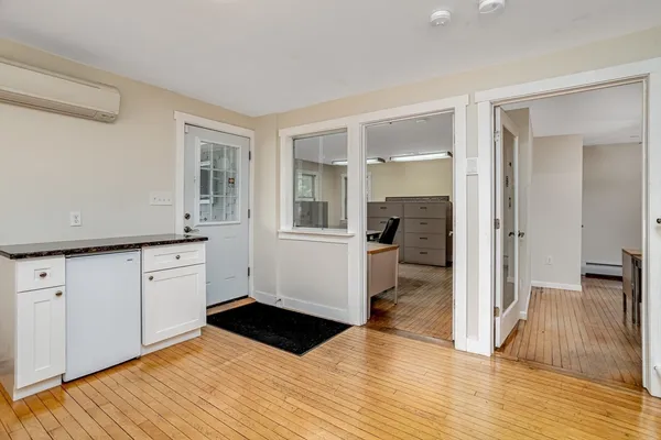 a kitchen with a refrigerator and a stove