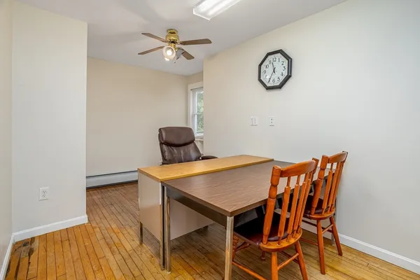 a view of a room with a table and a chair