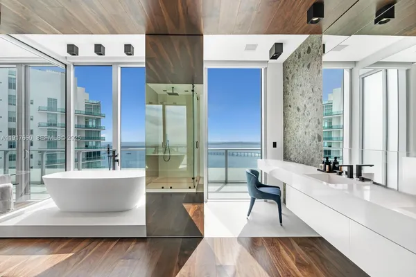 a bathroom with a shower and a sink