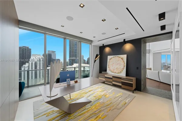 a lobby with furniture and a floor to ceiling window