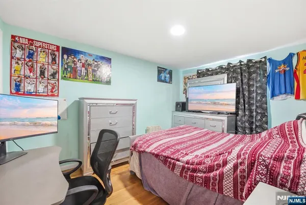 a bedroom with a bed and furniture