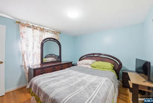 a bedroom with a bed and a chair
