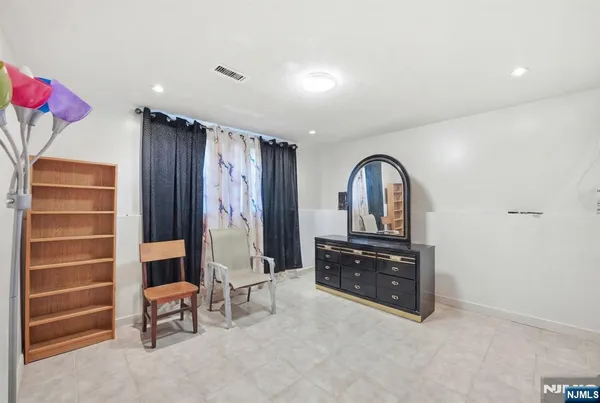 a bathroom with a sink vanity and toilet
