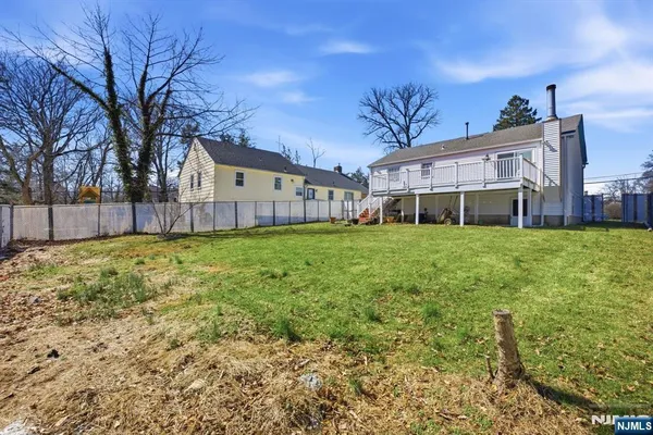 a view of a house with swimming pool in front of it