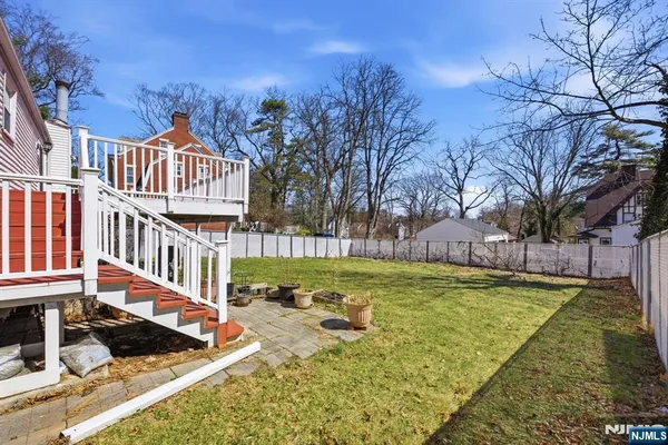 a view of a house with wooden deck