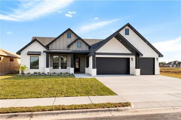 a front view of a house with swimming pool and porch with furniture