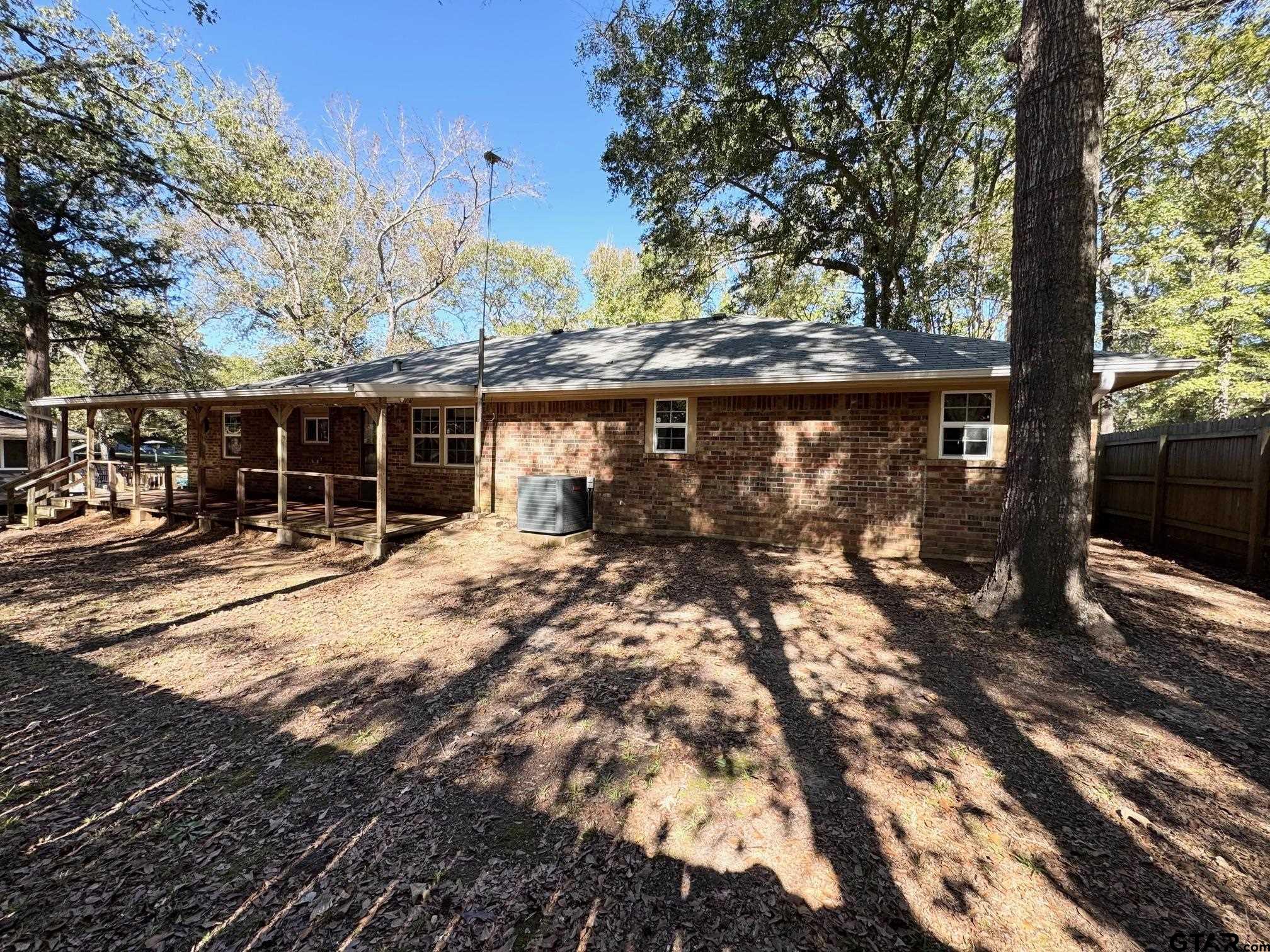 129 Dailey Road Crockett, TX 75835 - Photo 25 of 30 a backyard of a house with table and chairs