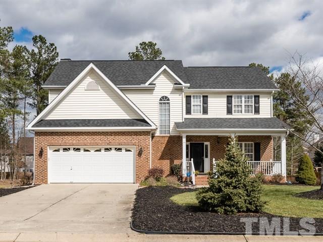 3553 Dewing Drive Raleigh, NC 27616 - Photo 1 of 25 a front view of a house with a yard and garage