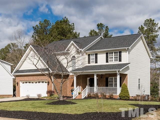 3553 Dewing Drive Raleigh, NC 27616 - Photo 2 of 25 a front view of a house with a yard and potted plants