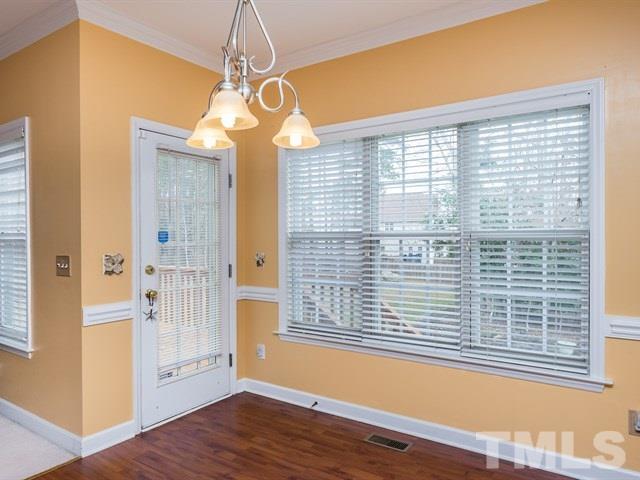 3553 Dewing Drive Raleigh, NC 27616 - Photo 14 of 25 a view of a livingroom with wooden floor and a window