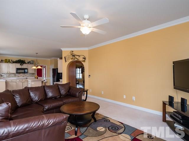 3553 Dewing Drive Raleigh, NC 27616 - Photo 16 of 25 a living room with furniture and a flat screen tv