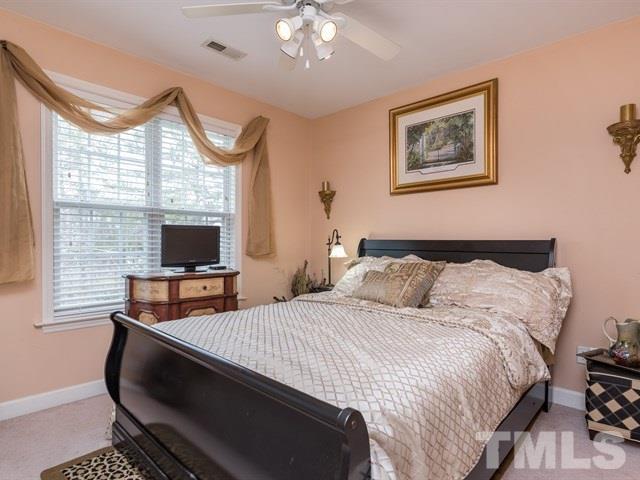 3553 Dewing Drive Raleigh, NC 27616 - Photo 22 of 25 a bedroom with bed tv and window