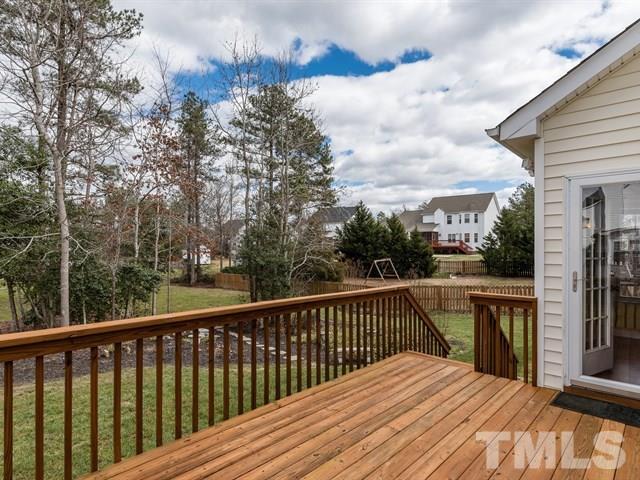 3553 Dewing Drive Raleigh, NC 27616 - Photo 24 of 25 a balcony with wooden floor and fence