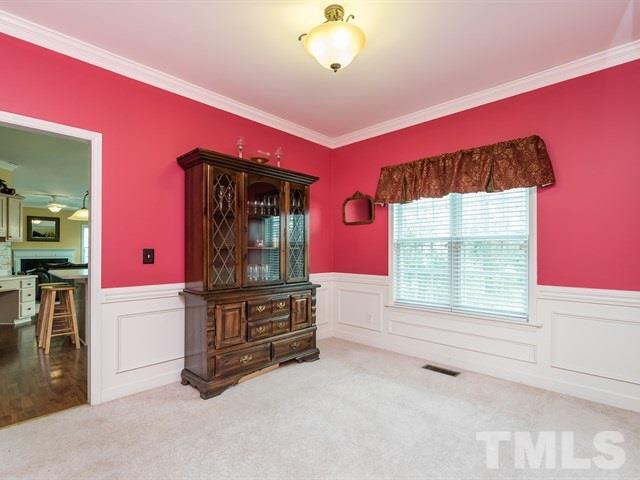 3553 Dewing Drive Raleigh, NC 27616 - Photo 7 of 25 a living room with furniture and a window