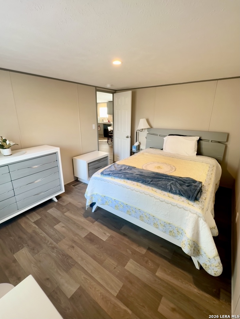 4858 Stanislaus Adkins, TX 78101 - Photo 14 of 19 a bedroom with a bed and a night stand