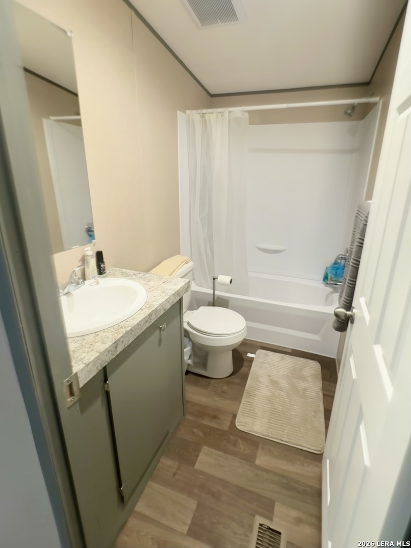 4858 Stanislaus Adkins, TX 78101 - Photo 17 of 19 a bathroom with a sink toilet and shower