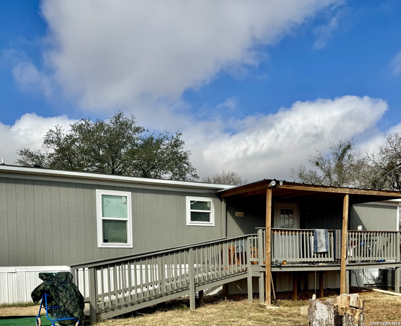 4858 Stanislaus Adkins, TX 78101 - Photo 2 of 19 a front view of a house with a yard