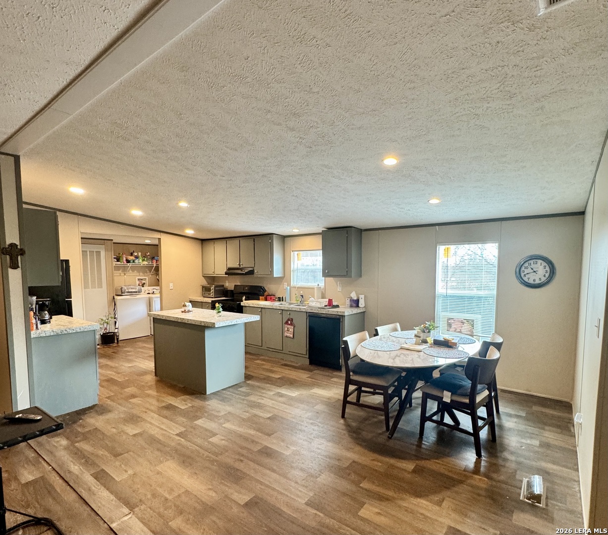 4858 Stanislaus Adkins, TX 78101 - Photo 6 of 19 a kitchen with a dining table chairs and view living room