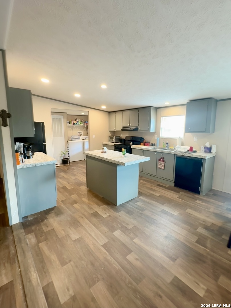 4858 Stanislaus Adkins, TX 78101 - Photo 8 of 19 a large white kitchen with cabinets a sink and a stove