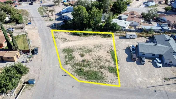 an aerial view of houses with yard