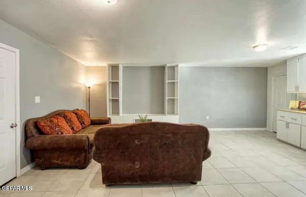 a living room with furniture and a rug