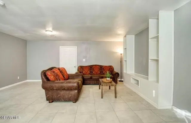 a kitchen with a sink cabinets and window