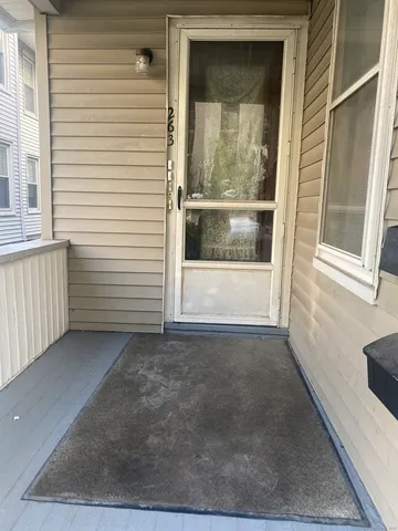 a view of a house with a small yard