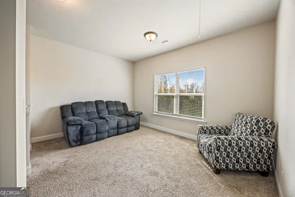 a spacious bedroom with a bed and a table