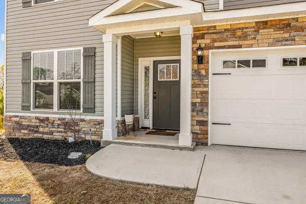 a front view of a house with glass windows