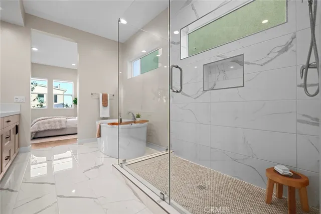 a bathroom with a tub and a shower