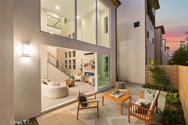 a balcony with furniture and a potted plant