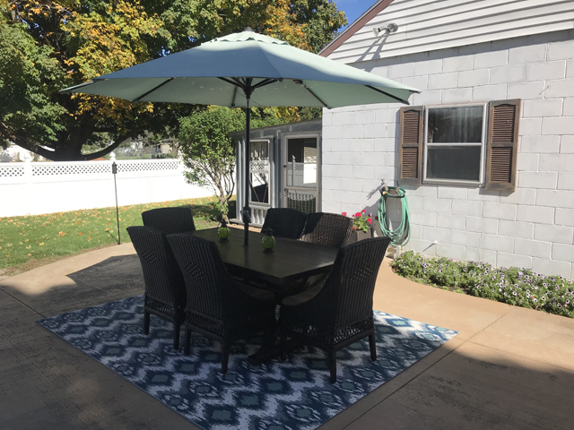 307 Prairie Street Spring Valley, IL 61362 - Photo 19 of 21 a view of a patio with table and chairs under an umbrella