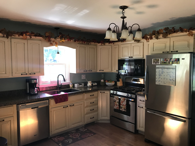 307 Prairie Street Spring Valley, IL 61362 - Photo 10 of 21 a kitchen with stainless steel appliances granite countertop a refrigerator a sink dishwasher a stove and white cabinets