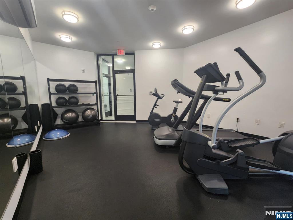 77 Ridge, Unit 306 North Arlington, NJ 07031 - Photo 16 of 23 a view of a room with gym equipment