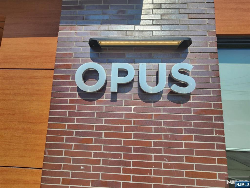 77 Ridge, Unit 306 North Arlington, NJ 07031 - Photo 2 of 23 a brick building with a clock on it