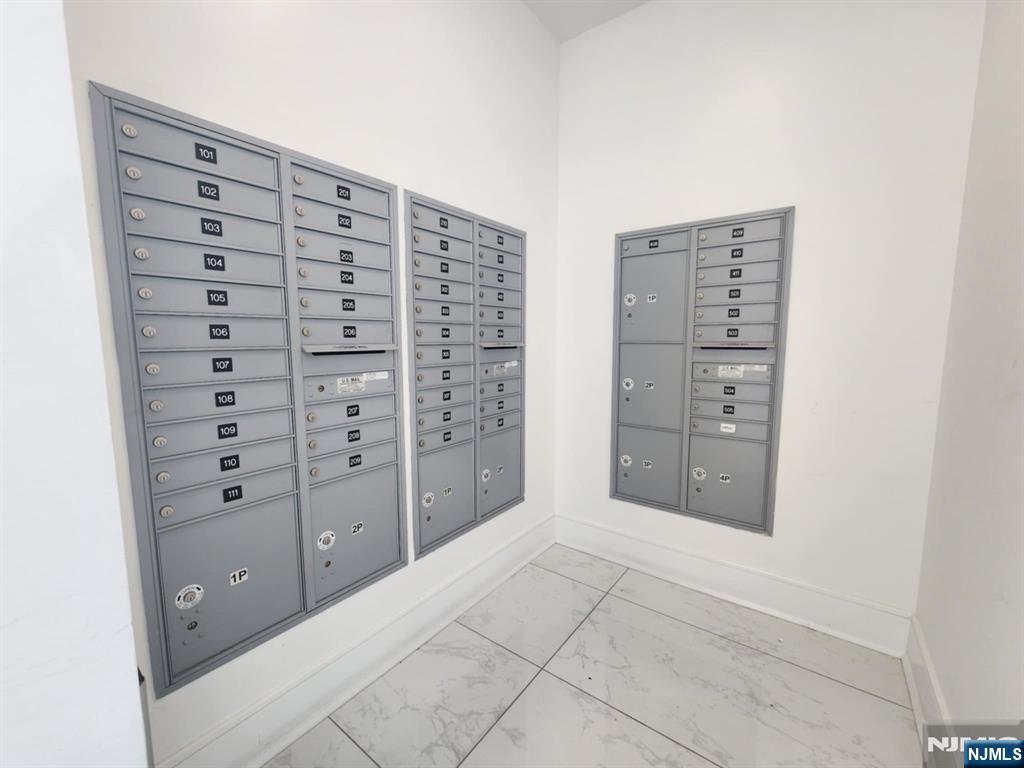 77 Ridge, Unit 306 North Arlington, NJ 07031 - Photo 22 of 23 a view of walk in closet with empty racks